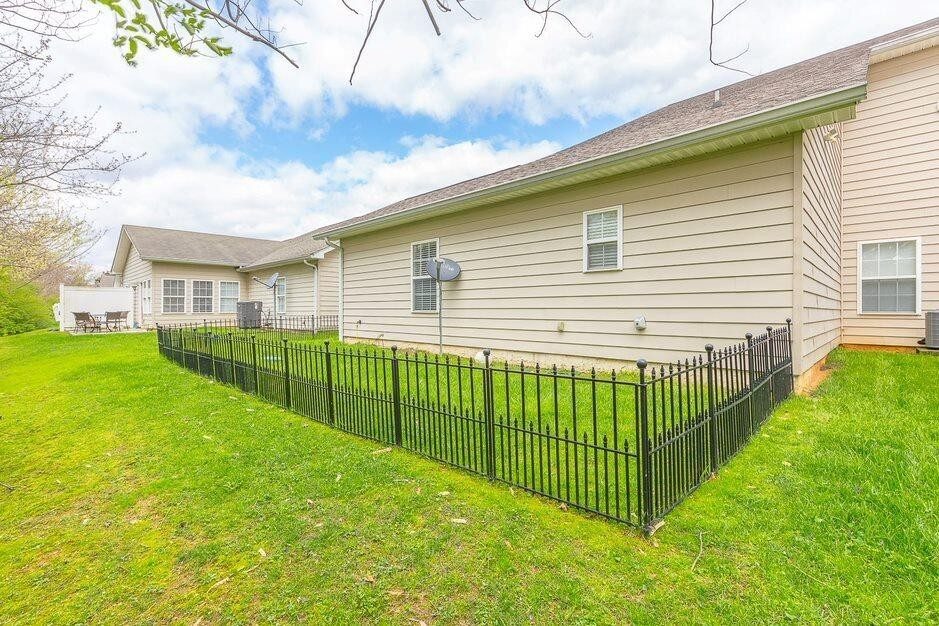 The back of the row and the small fenced yard