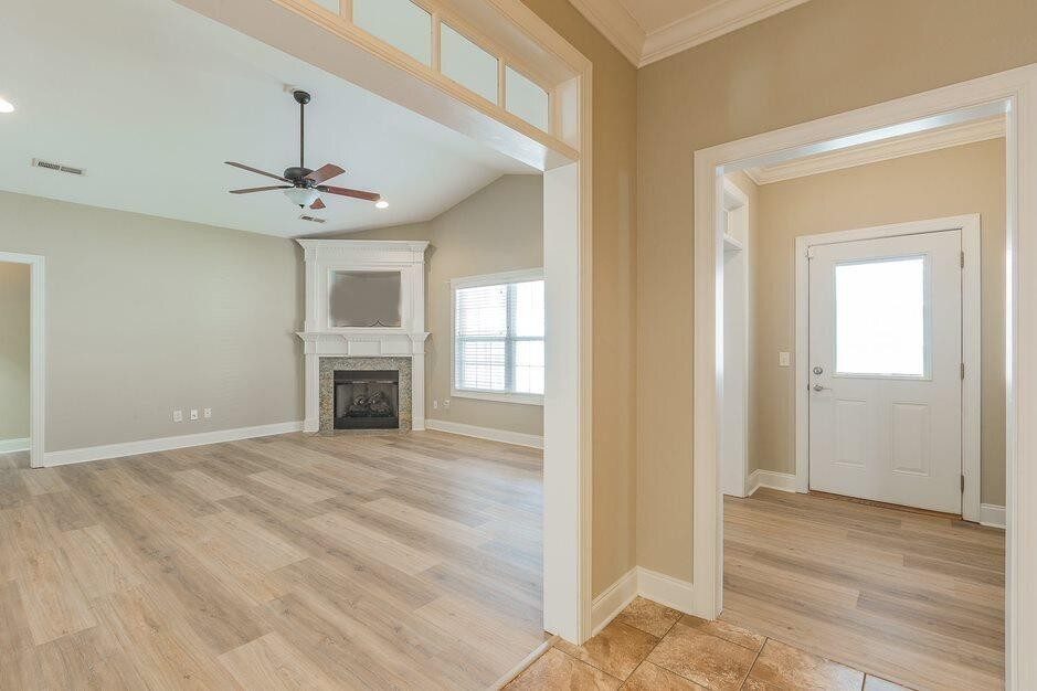The family room with its corner gas fireplace